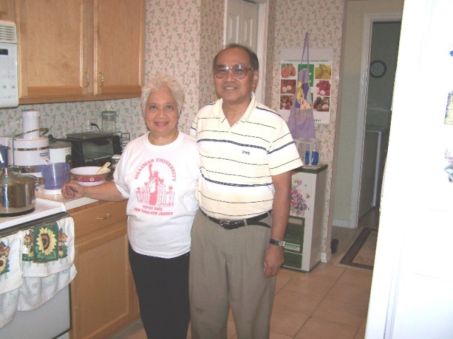 Ed and Ruby Agnir, hosts of the Oct 7 gathering pose in their kitchen