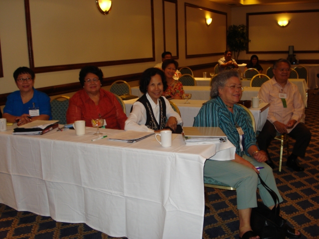 Meeting of SUACONA Board of Directors. Front: Tonette Geary, Zeny Bennett, Ester Elphick, Rachel Alegado. Next row: Flor Bayawa, Gideon Alegado