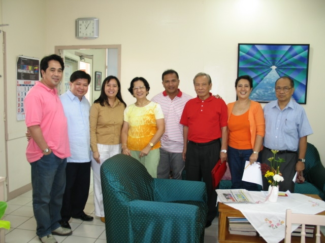 A typical morning where newcomers arrive and are greeted by Jong de la Cruz and Inday Maxino. Also in photo are Justice & Mrs. Isaias Dicdican (in red), Dr. Agnir and Trustee Felipe Remollo (2nd from left)